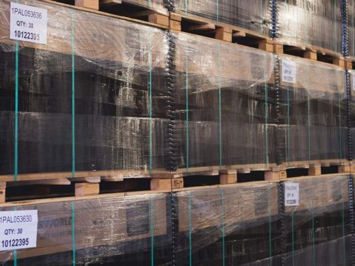 Solar panels stacked in warehouse