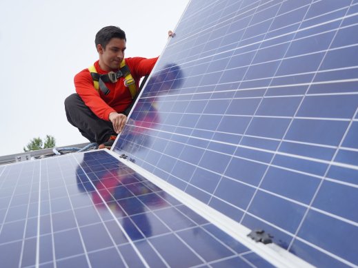 Volunteer with Solar Panel Volunteer with Solar Panel