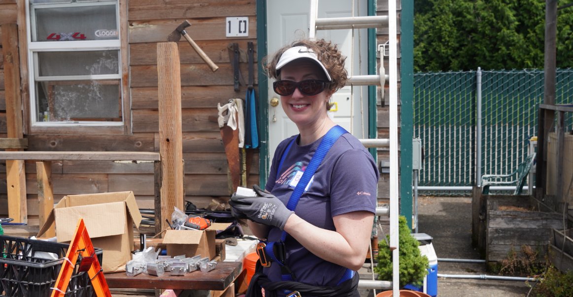 Smiling Volunteer at Solar Installation Smiling Volunteer at Solar Installation