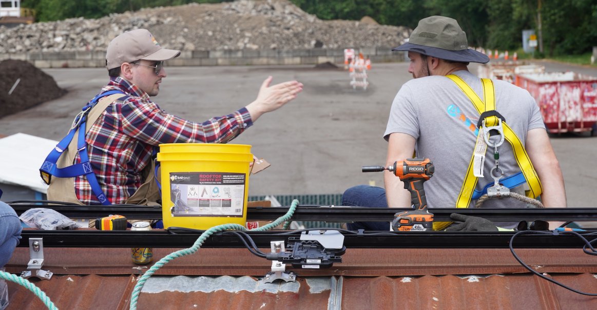 Solar Volunteers on Roof Solar Volunteers on Roof