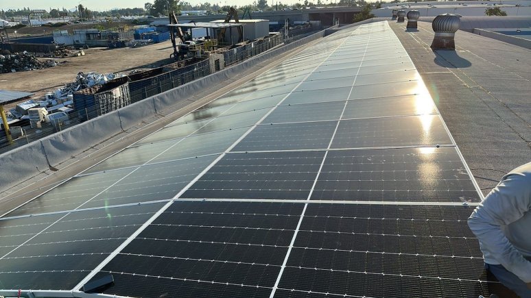 Solar panel installation on warehouse rooftop