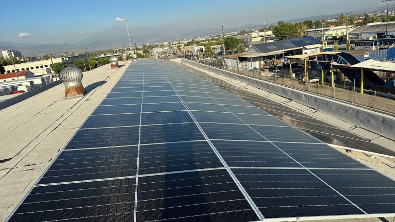 Solar panel installation on warehouse rooftop