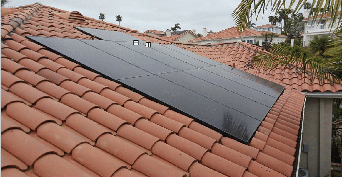 Left side view of solar panel system on rooftop. Left side view of solar panel system on rooftop.